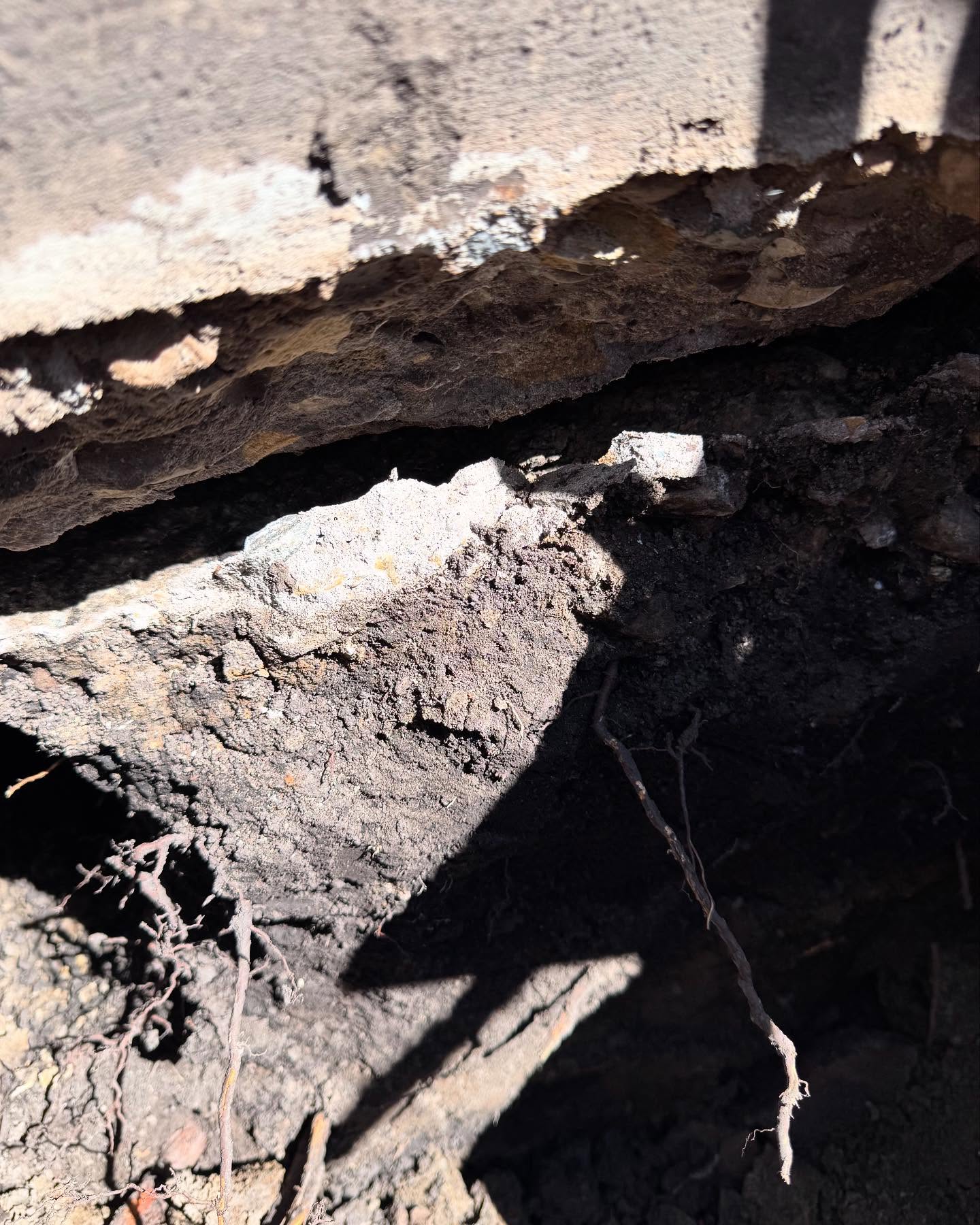 Oh the ‘60’s when concrete was cheap! This step was a few truckloads of solid concrete fastened into the basement wall. As the 24” concrete piles settled over the decades, the basement wall cracked on both sides of the step and pulled away. Lifted it a few inches and now it’ll never move again! #screwpiles #foundationlifting #foundationrepair #camrose #alberta #helicalpiles
