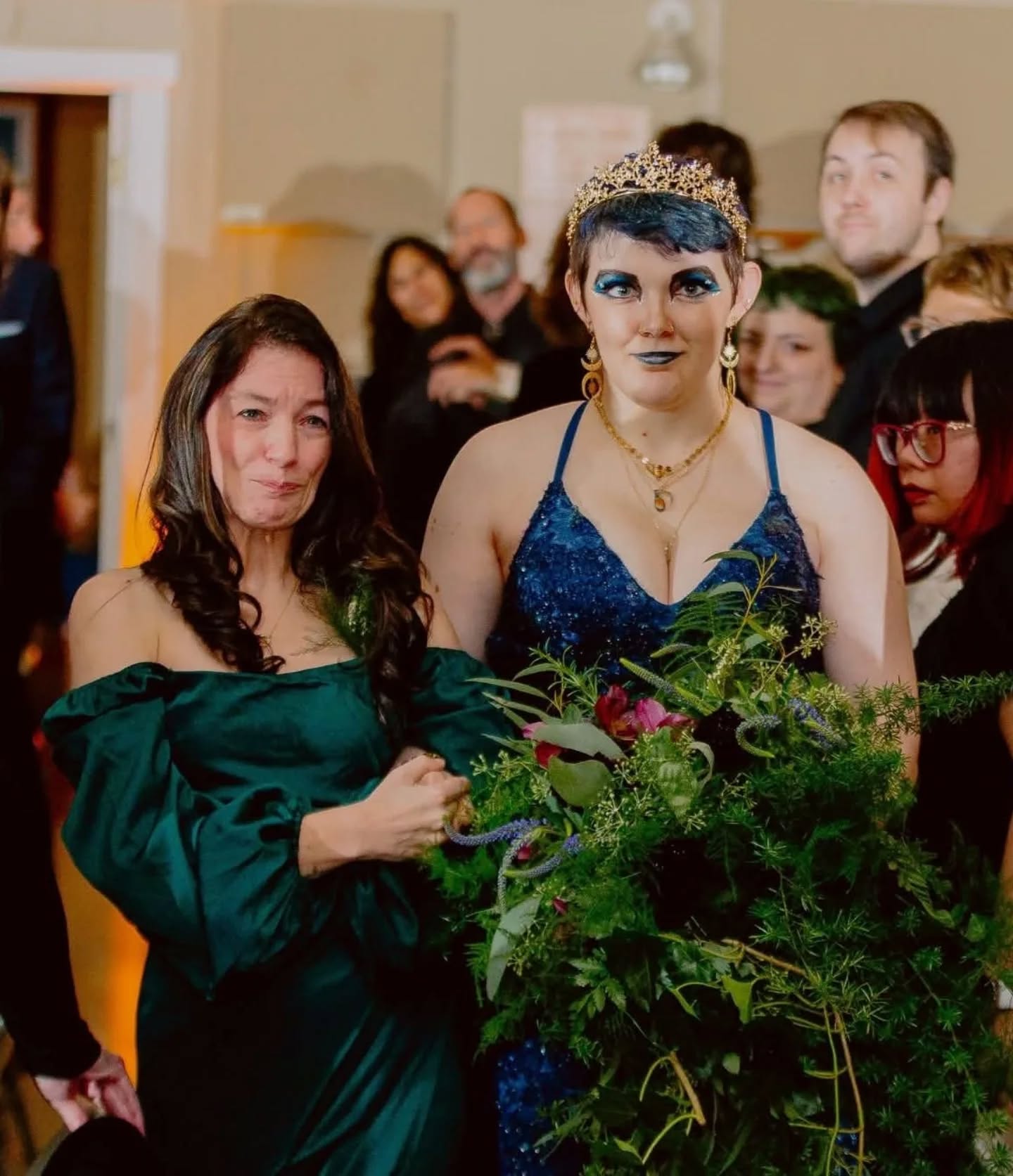 Yes, that sobbing lady in green is me.
I didn't even have time to put makeup on ... Not that it would have mattered because I would have just cried it all off.
My whole face did me wrong. Who cries like that?!?
No matter what, just know you don't look like THIS when you're crying on the wedding day.
Also, that's my awesome kid on their wedding day. Don't they look amazing???